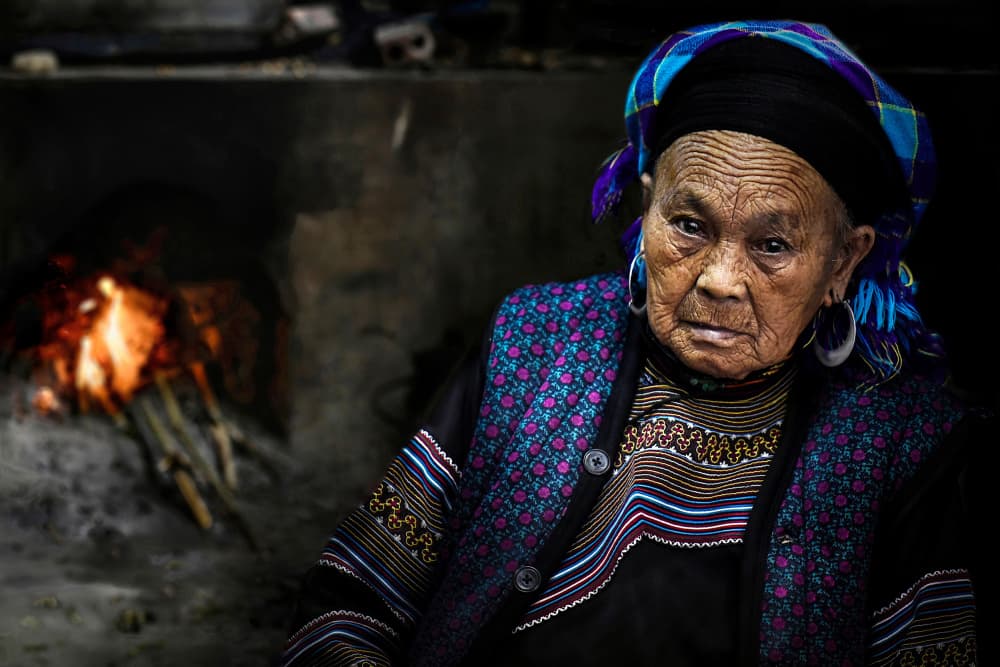 Elderly Woman By Firelight by Irene Perovich — canvas wall art