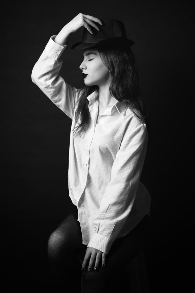 Pensive Hat Portrait by Glamour Studio — canvas wall art