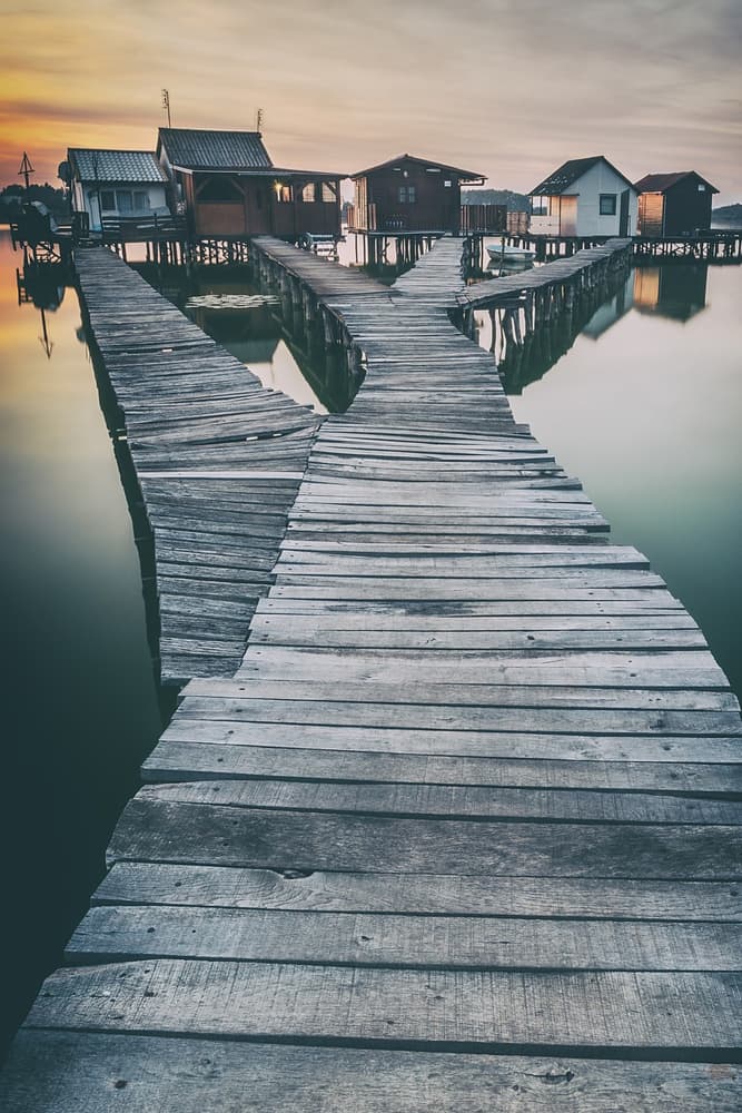 Peaceful Lake Village by Pavol Stranak — canvas wall art