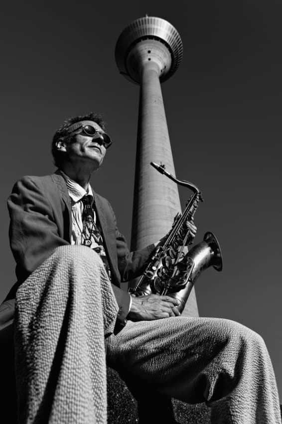 Cool Saxophonist City Tower by Klaus Ratzer — canvas wall art