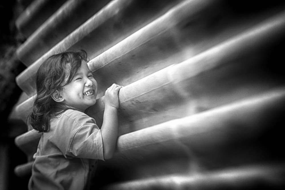 Joyful Child Laughing by Angela Muliani Hartojo — canvas wall art