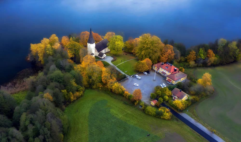 Colorful Autumn Church by Karim Al Thahaby — canvas wall art