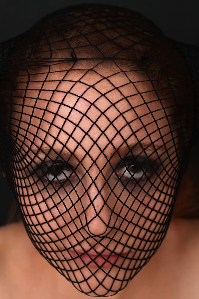 Woman In Fishnet Mask by David McCracken — canvas wall art