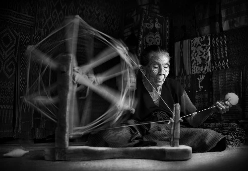 Traditional Spinner at Work by Aman Ali Surachman — canvas wall art