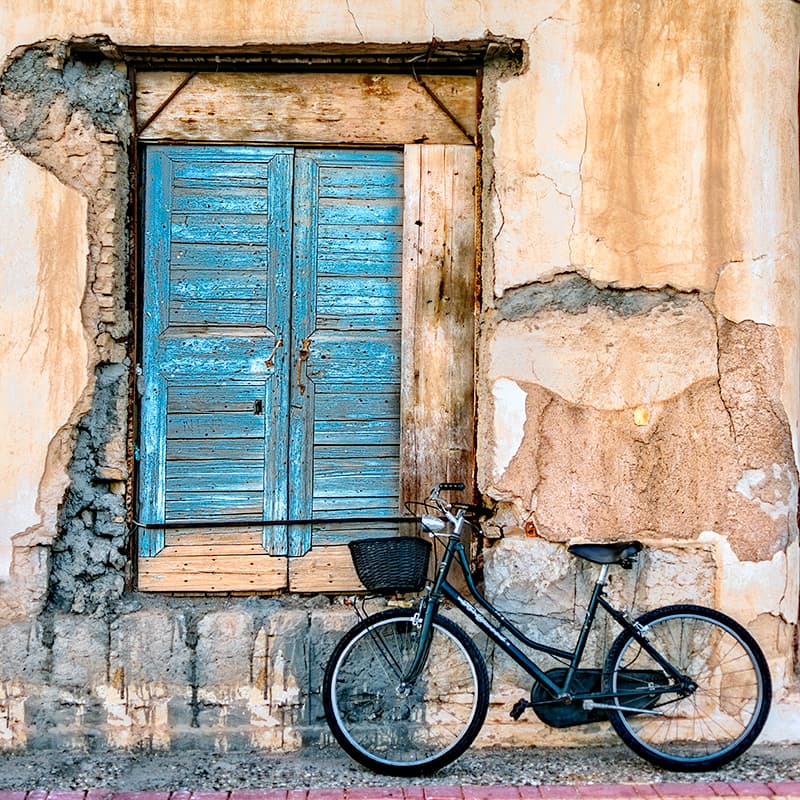 Blue Shutters Bicycle by George Digalakis — canvas wall art