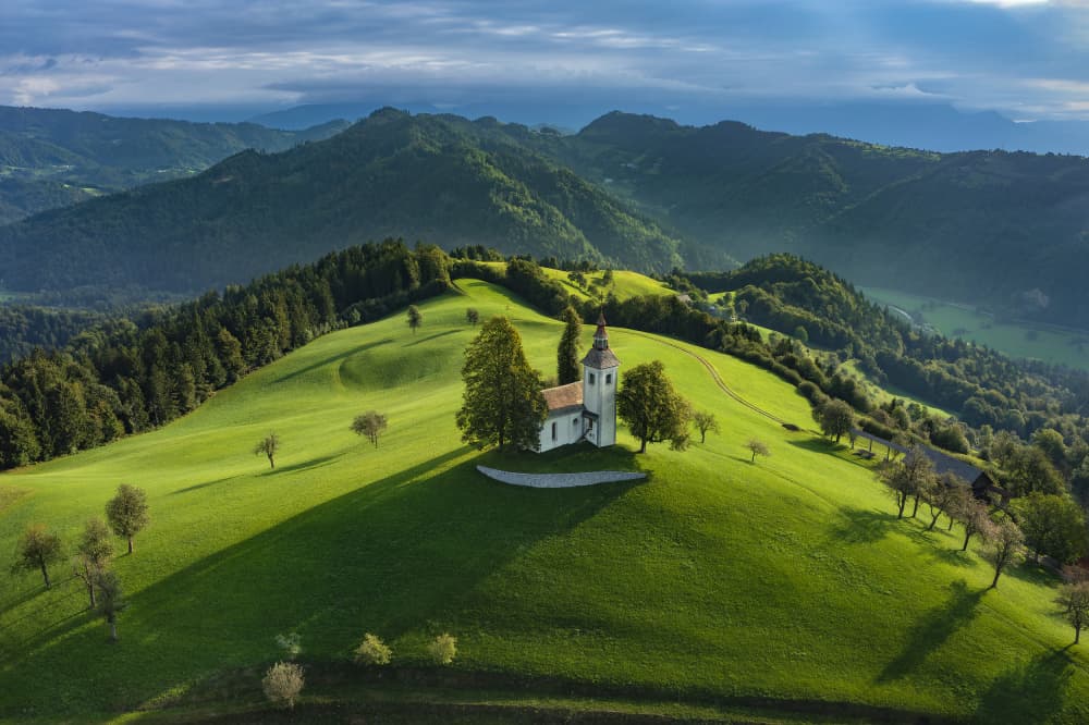Church on Rolling Hills by Jure Kravanja — canvas wall art