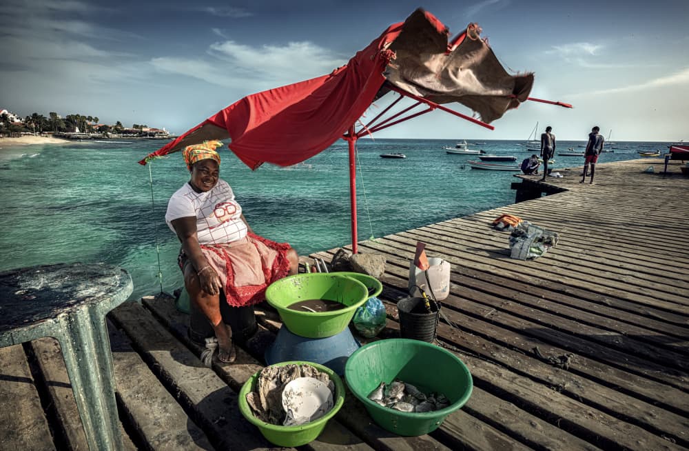 Smiling Fish Seller by Waldemar Szmidt — canvas wall art