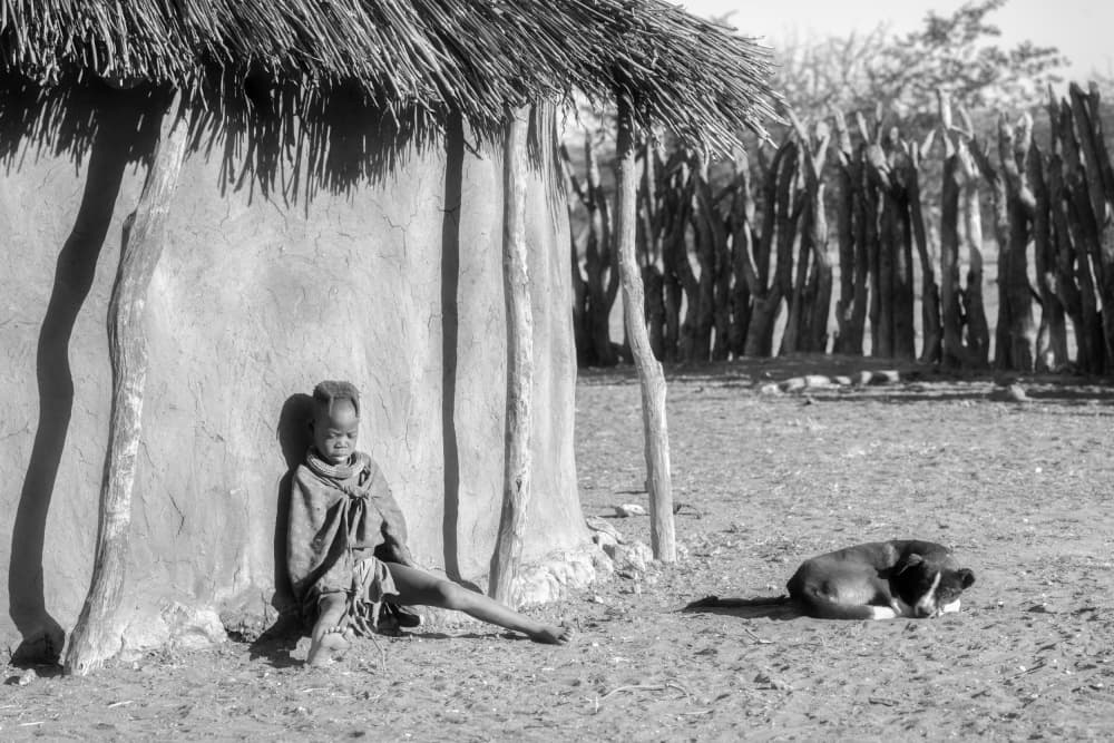 African Child and Dog by Joan Zhang — canvas wall art