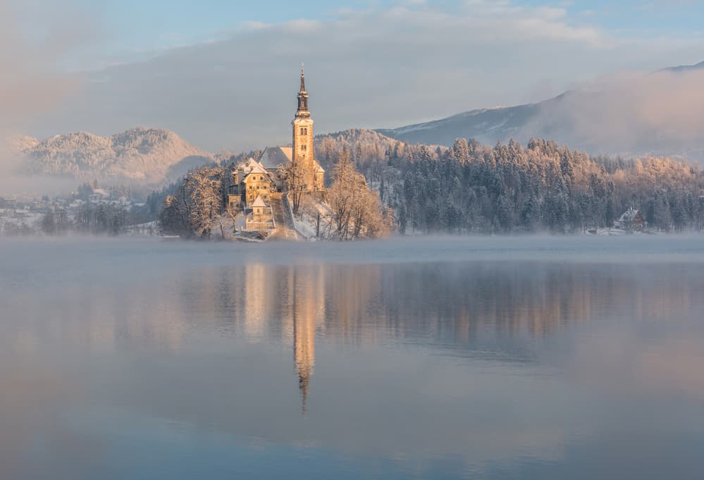 Misty Bled Island Winter by Ales Krivec — canvas wall art