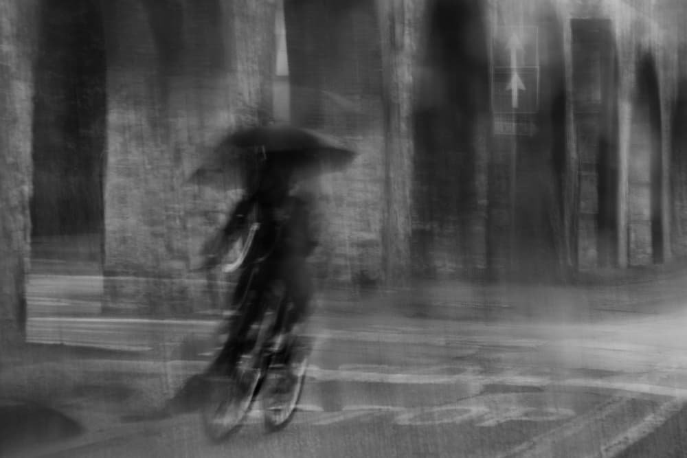 Rainy City Cyclist by Claudio Moretti — canvas wall art