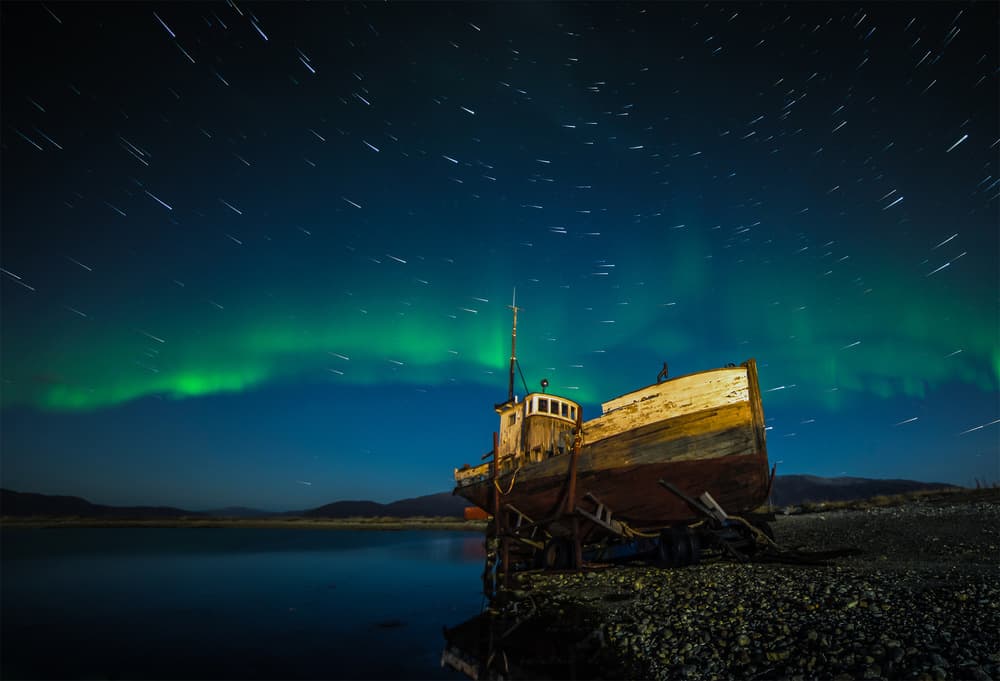 Northern Lights Old Boat by Zoltan Tot — canvas wall art