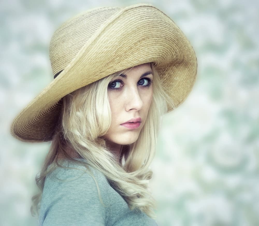 Pensive Woman Straw Hat by kenp — canvas wall art