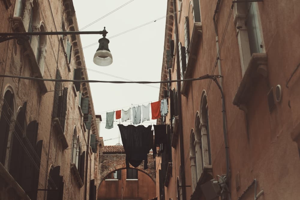 Old City Laundry Day by Alla Simacheva — canvas wall art