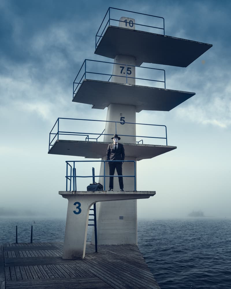 Masked Man Diving Tower by Petri Damstén — canvas wall art