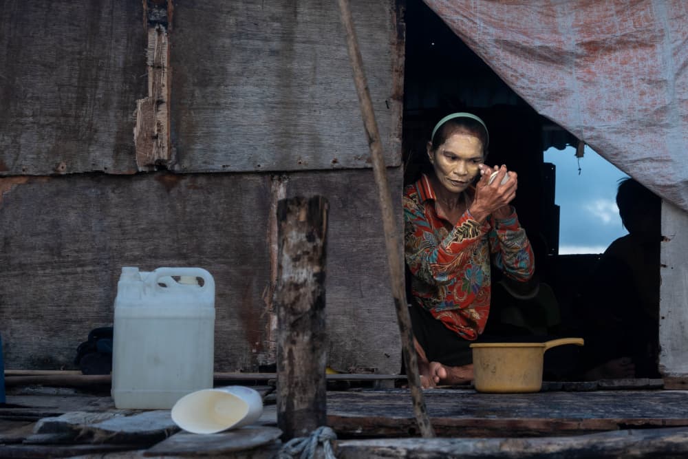 Woman Applying Thanaka by Hafiz Ismail — canvas wall art