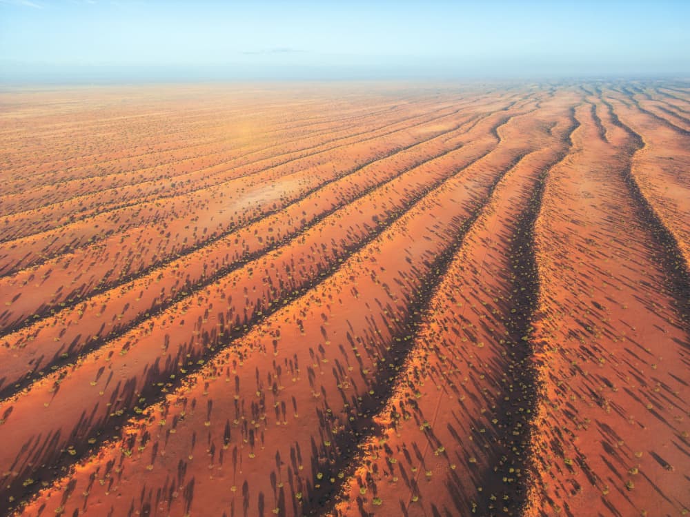 Red Desert Patterns by Jean Claude Castor — canvas wall art