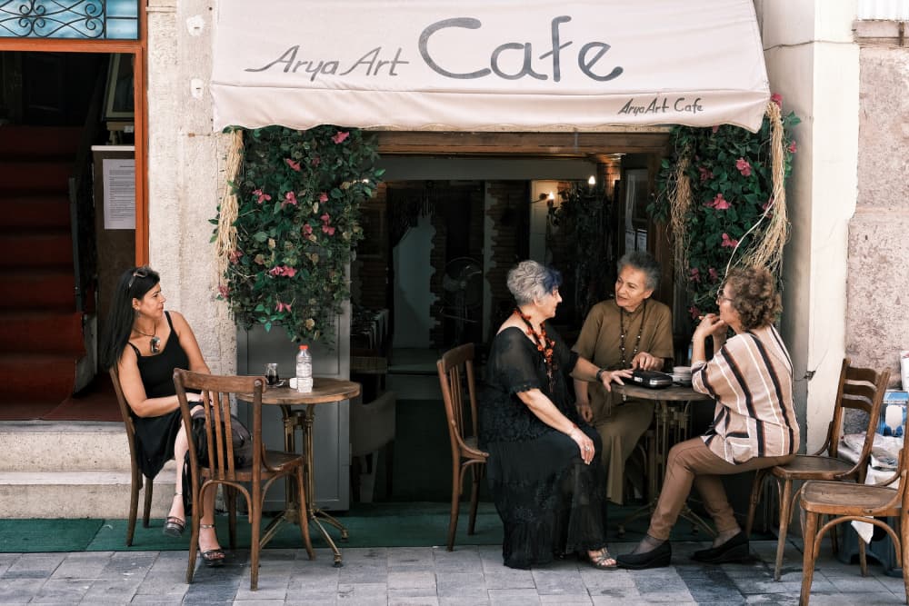 Friends At Street Cafe by Ali Ayer — canvas wall art