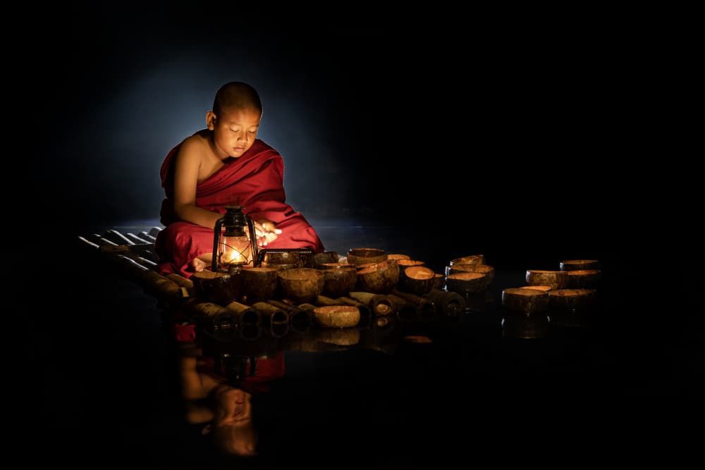 Young Monk's Lantern Light by Muljati Hidajat — canvas wall art