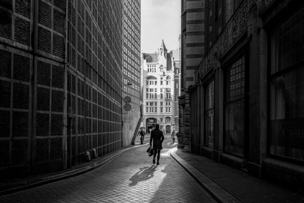 Man Walking Historic Street by Jaap Koer — canvas wall art