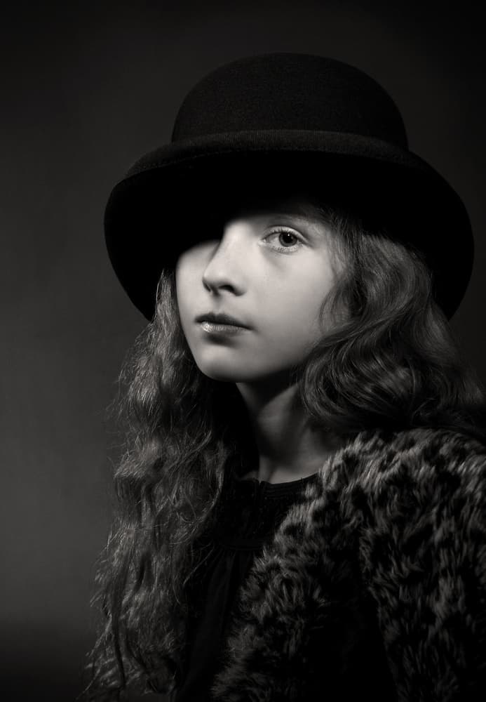 Elegant Girl Bowler Hat by Jan Scheunders — canvas wall art