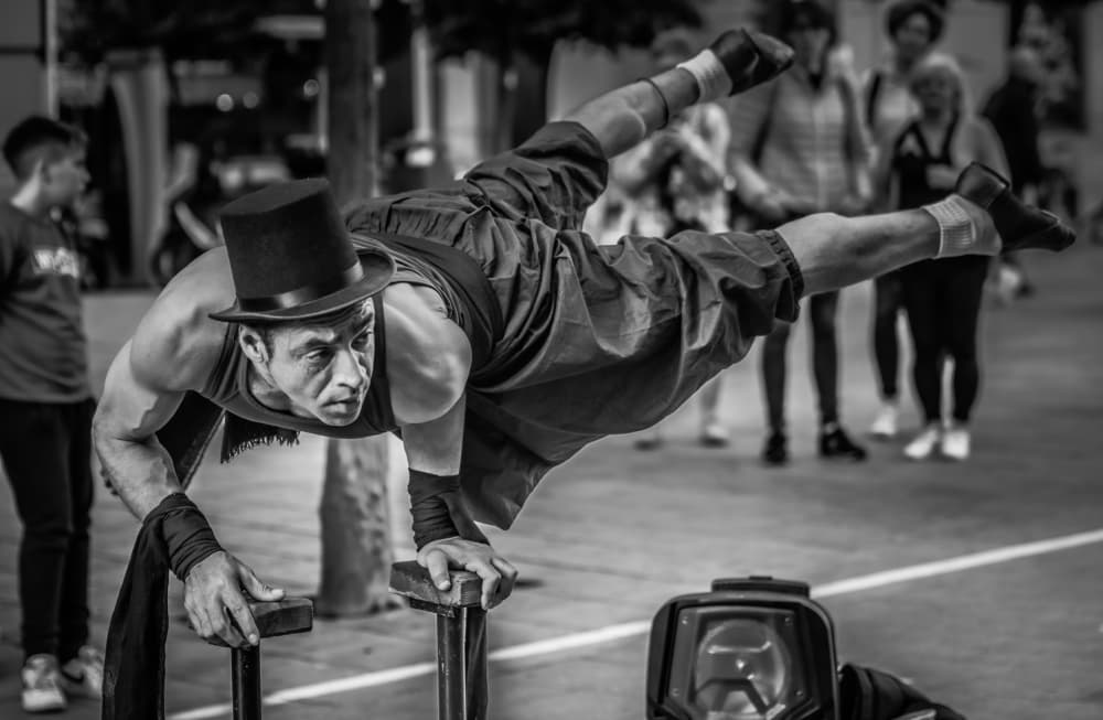 Street Performer's Balance by PacodlaCorte — canvas wall art