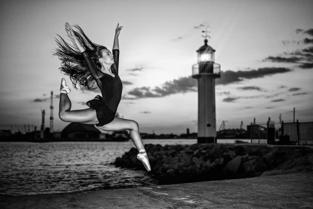 Ballerina Leaps at Lighthouse by Vasil Nanev — canvas wall art
