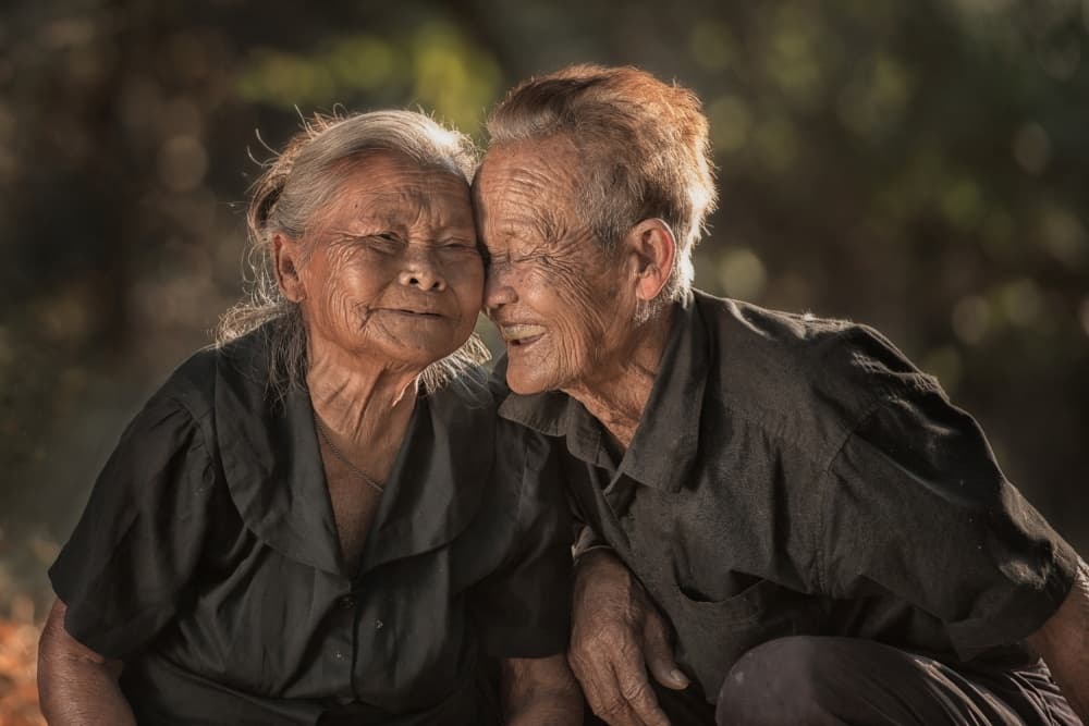 Loving Elderly Couple by Sarawut Intarob — canvas wall art
