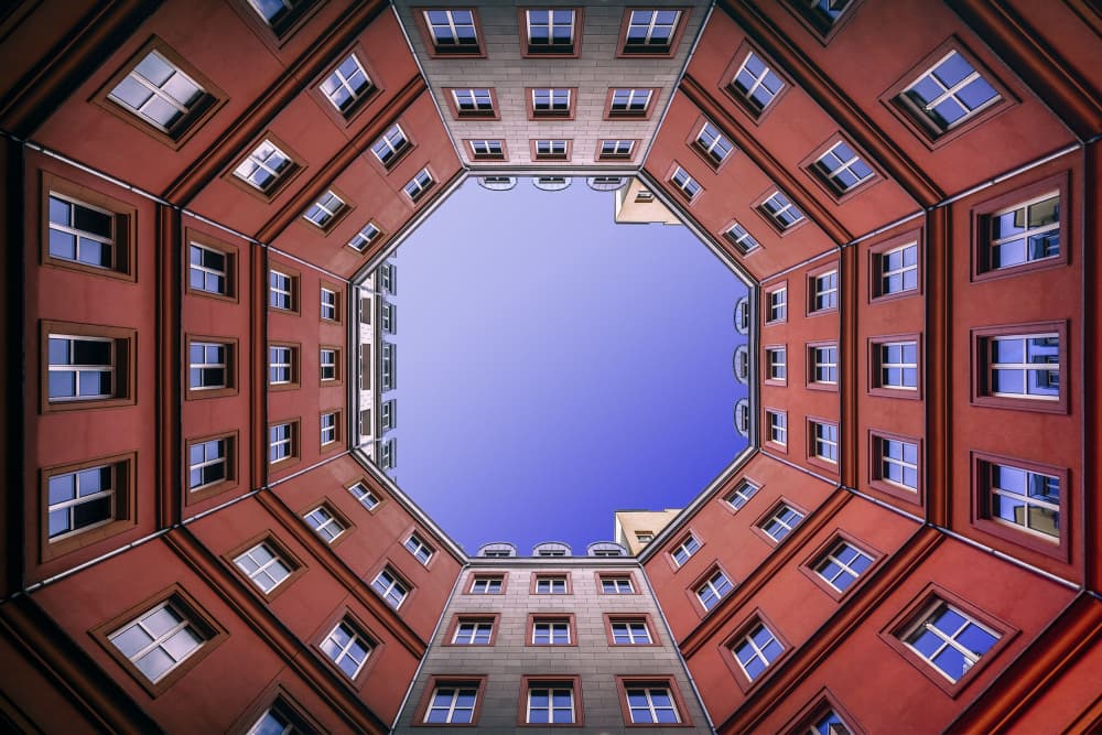 Urban Courtyard Skyward by Michael Eßig — canvas wall art