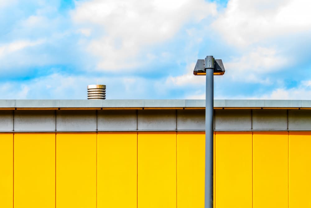 Yellow Wall Blue Sky by Heike Wolters-Wrase — canvas wall art