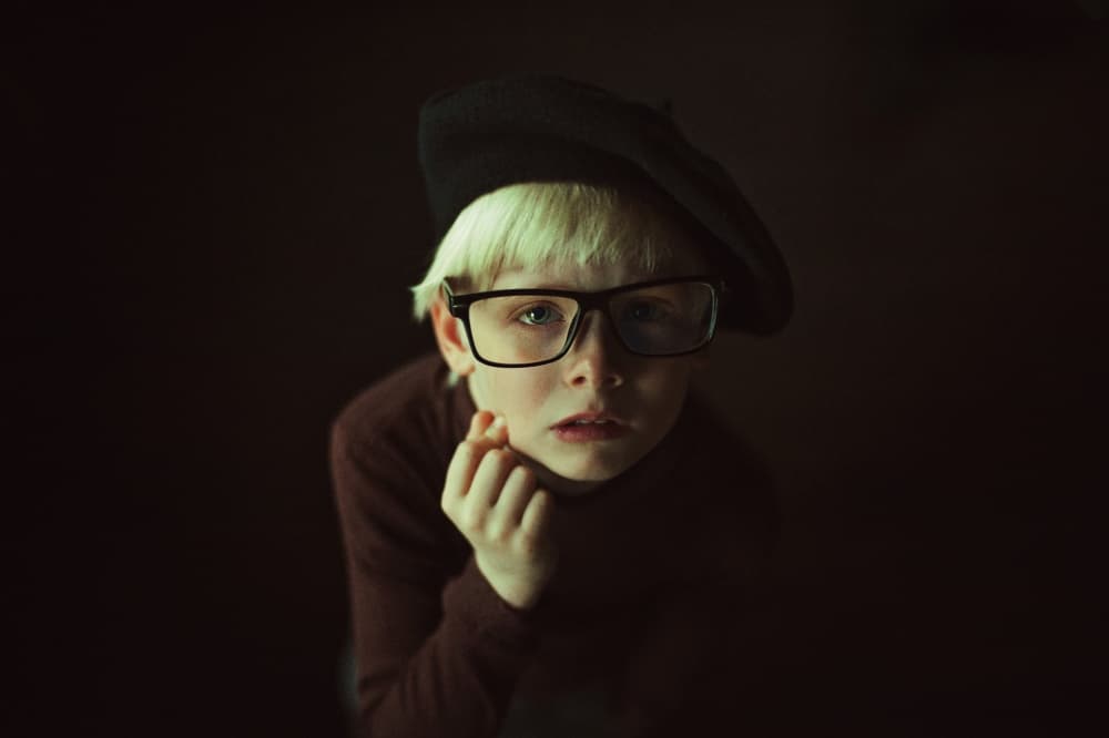 Pensive Child in Beret by Natalia Zhukova — canvas wall art