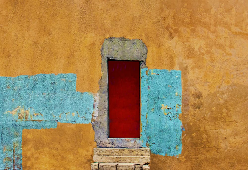 Red Door on Textured Wall by Arnon Orbach — canvas wall art
