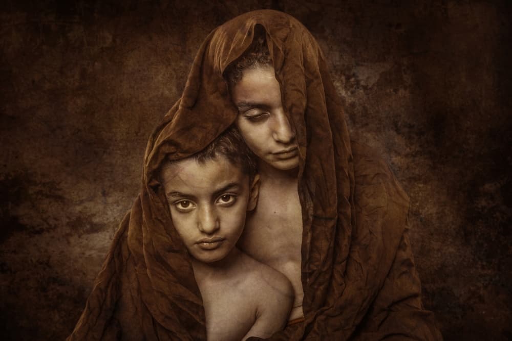 Children's Protective Embrace by Ali Al-Jazeri — canvas wall art