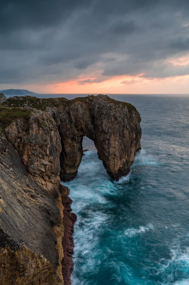 Moody Coastal Arch by Alvaro Roxo — canvas wall art