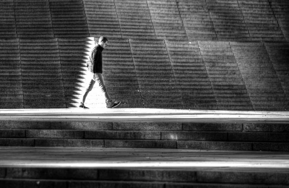 Shadowed Urban Stroll by Anna Niemiec — canvas wall art