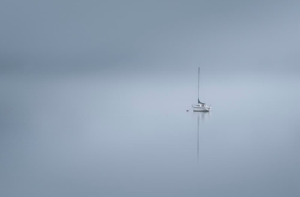 Serene Boat Reflection by David Ahern — canvas wall art