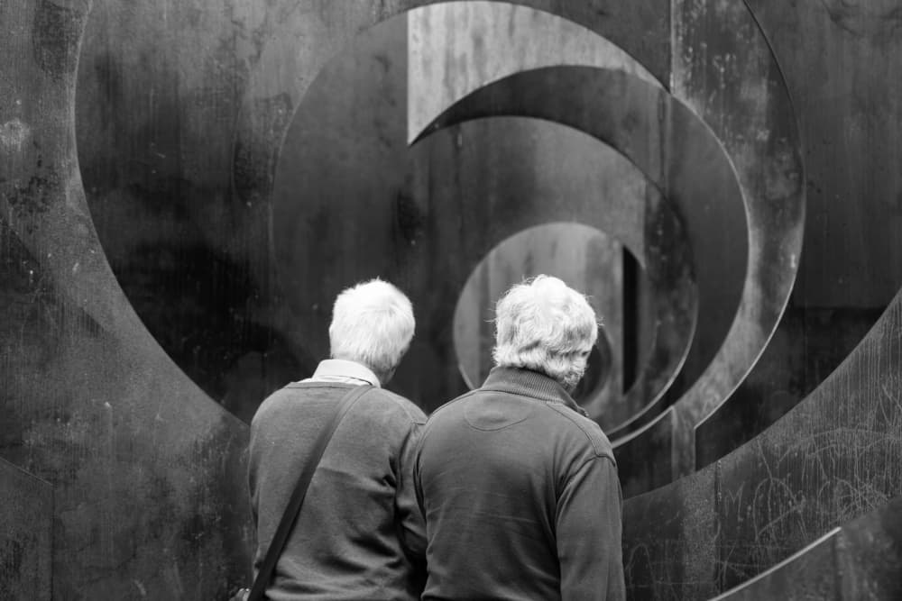 Seniors Contemplating Sculpture by Michelle Degryse — canvas wall art