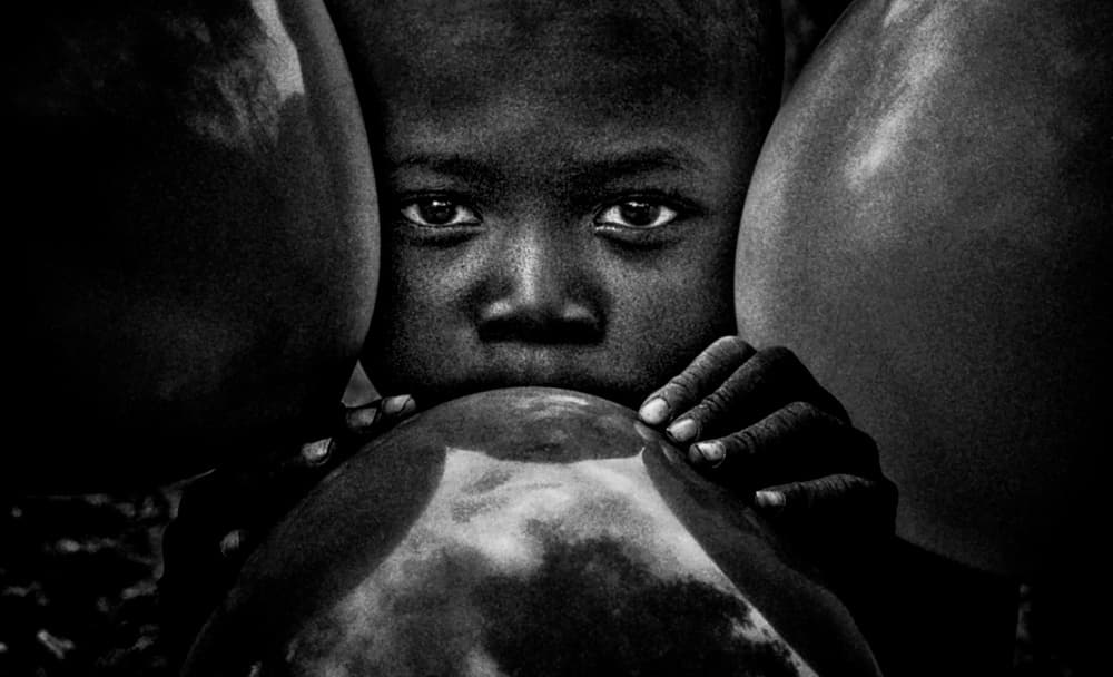 Child's Intense Gaze by Joxe Inazio Kuesta Garmendia — canvas wall art