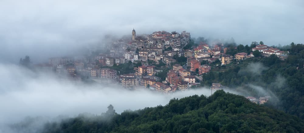 Misty European Hill Town by Riccardo Lucidi — canvas wall art