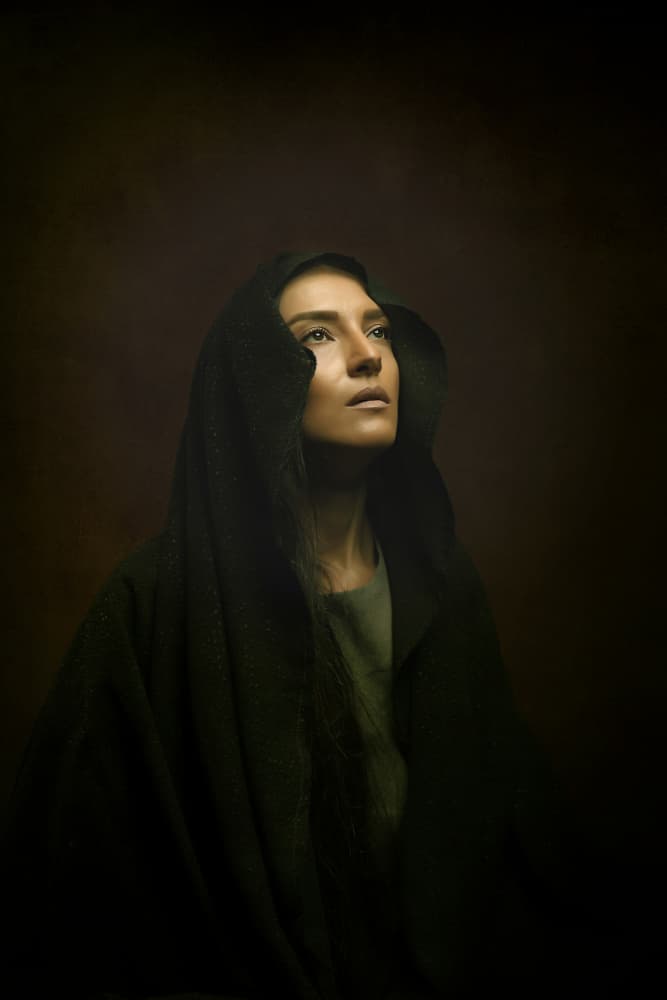 Contemplative Hooded Woman by Moein Hasheminasab — canvas wall art