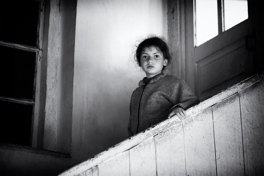 Solemn Child Portrait by Marcel Rebro — canvas wall art