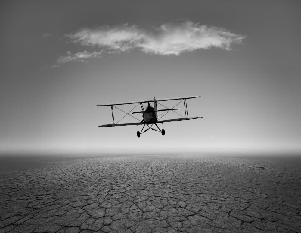 Biplane Over Cracked Earth by Cesare Sent — canvas wall art