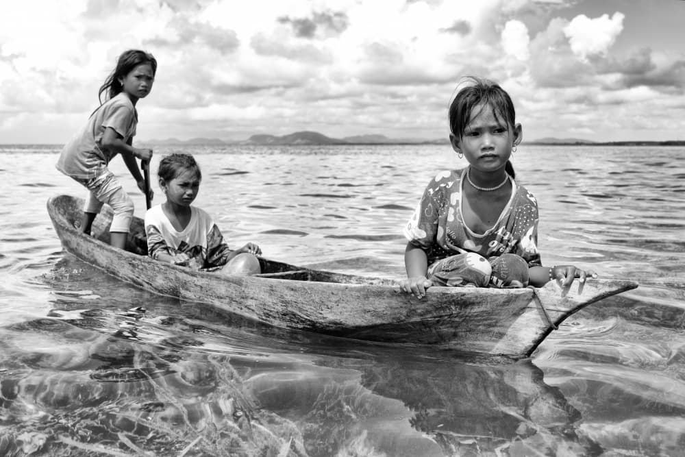 Island Children Boat by Kieron Long — canvas wall art