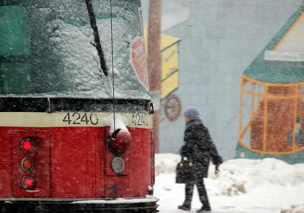 Snowy City Streetcar by Jian Wang — canvas wall art