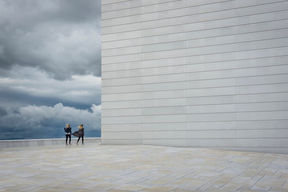 Two Women Under Stormy Skies by Anita Vidic Grah — canvas wall art
