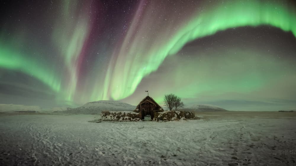Northern Lights Winter Cabin by Tomás Hueso Marco — canvas wall art