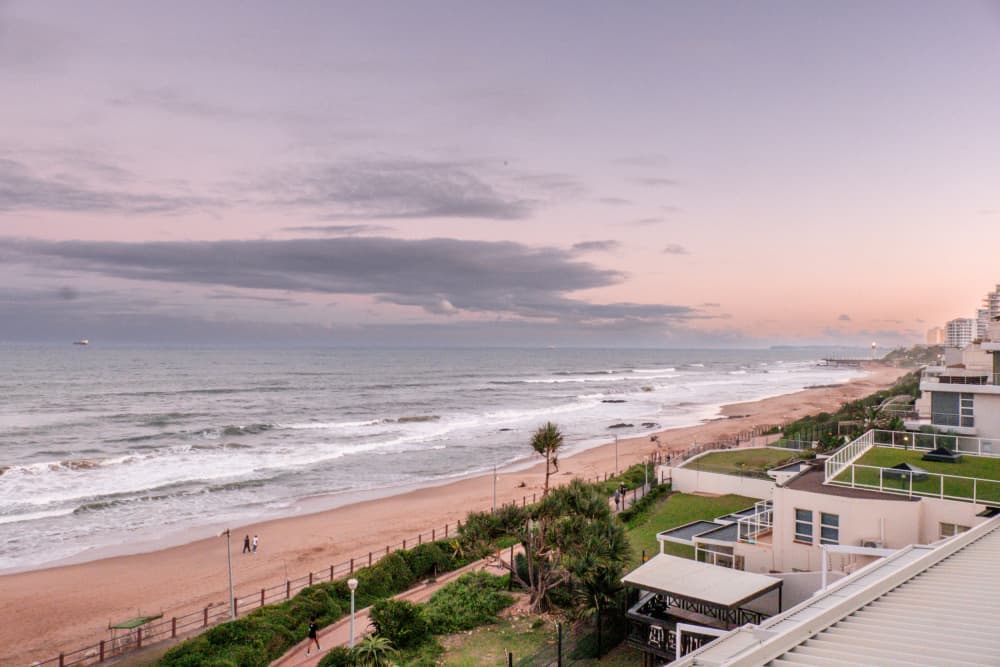 Pink Sky Over Beach by Dan Edwards — canvas wall art