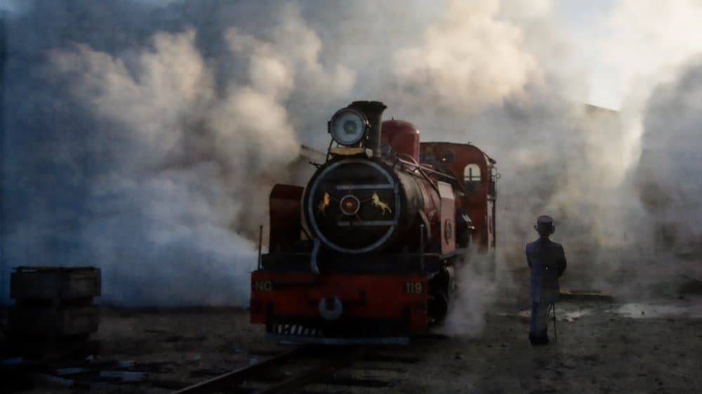 Man and Steam Train by Peet van den Berg — canvas wall art