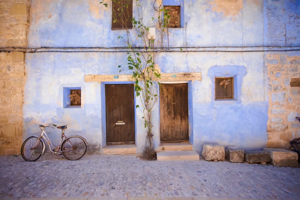 Rustic Blue Building Bicycle by Paco Palazon — canvas wall art