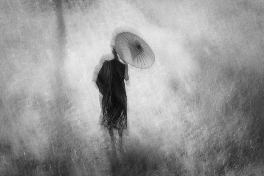 Serene Monk with Umbrella by ADIREK M — canvas wall art