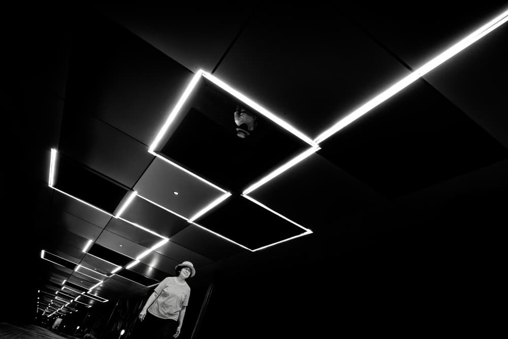 Woman in Neon Hallway by Rahmad Adriansyah — canvas wall art
